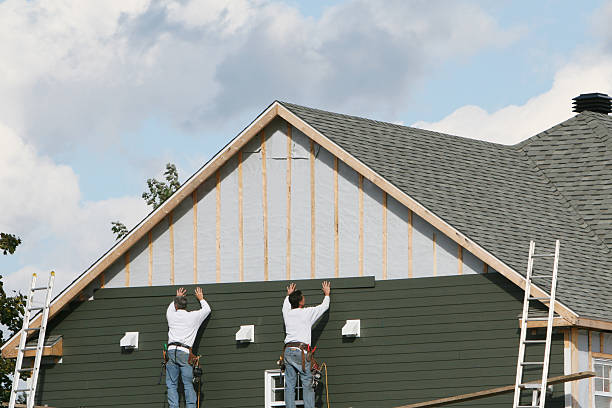 Professional Siding technician working in Henderson, CO